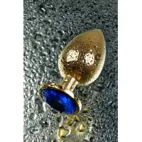 Изображение Metal by TOYFA Анальная втулка Metal by TOYFA, металл, золотая, с синим кристаллом, 9,5 см, Ø 4 см, 145 г