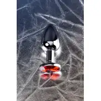 Фото Metal by TOYFA Анальная втулка Metal by TOYFA, металл, серебряная, с красным кристаллом, 7,1 см, Ø 2,7 см, 150 г