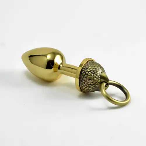 Фото  Анальная втулка The Parrot Metal Butt Plug-gold