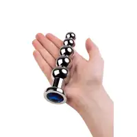 Фото Attitude Solution Ltd Анальная втулка Metal by TOYFA, металл, серебряная, с синим кристаллом, 14 см, Ø 3,4 см, 190 г