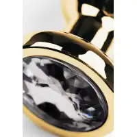 Фото Attitude Solution Ltd Анальная втулка Metal by TOYFA, металл, золотая, с кристаллом цвета алмаз, 10 см, Ø 3 см, 95 г